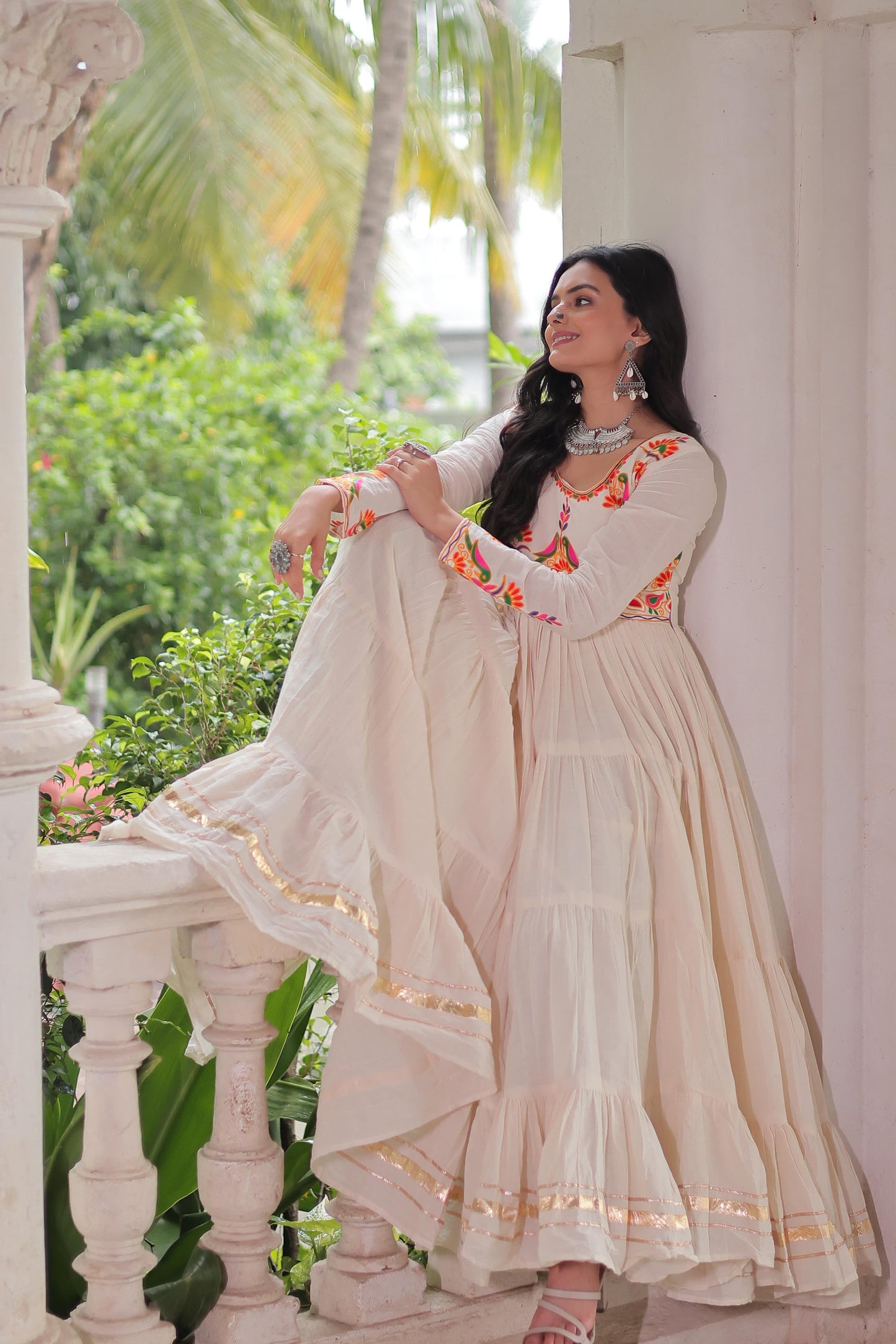 Off white color gown in cotton fabric with 10 + meter flair