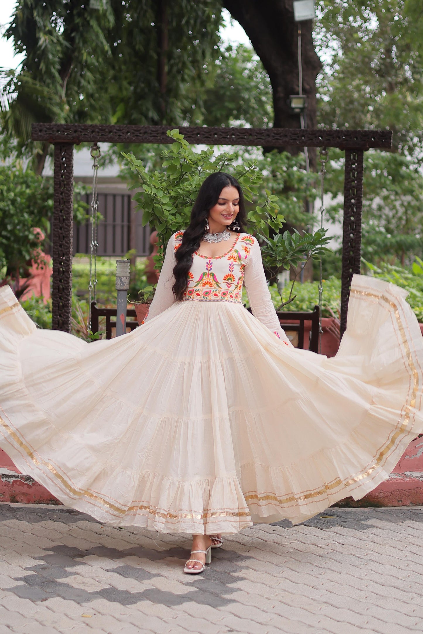 Off white color gown in cotton fabric with 10 + meter flair