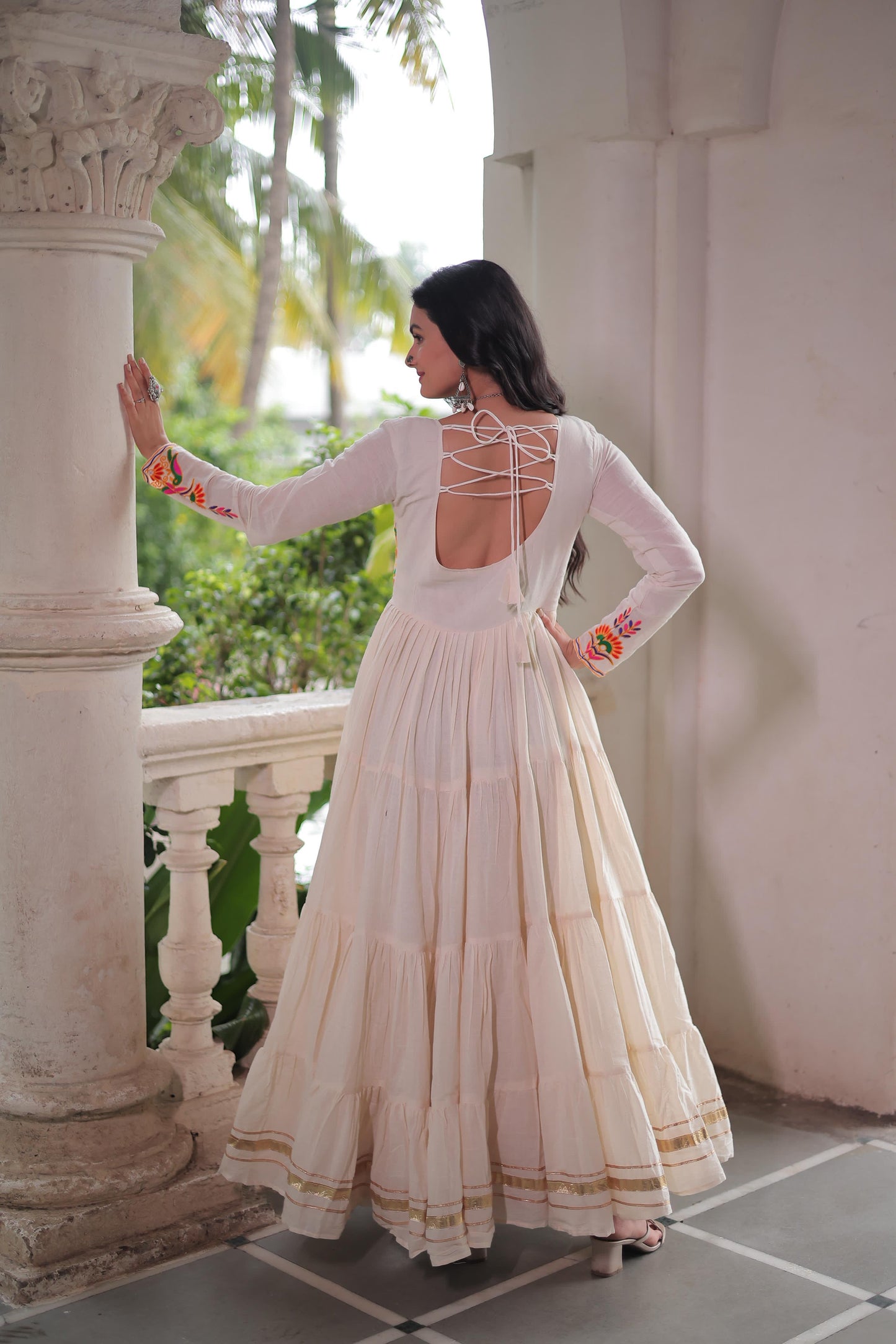 Off white color gown in cotton fabric with 10 + meter flair
