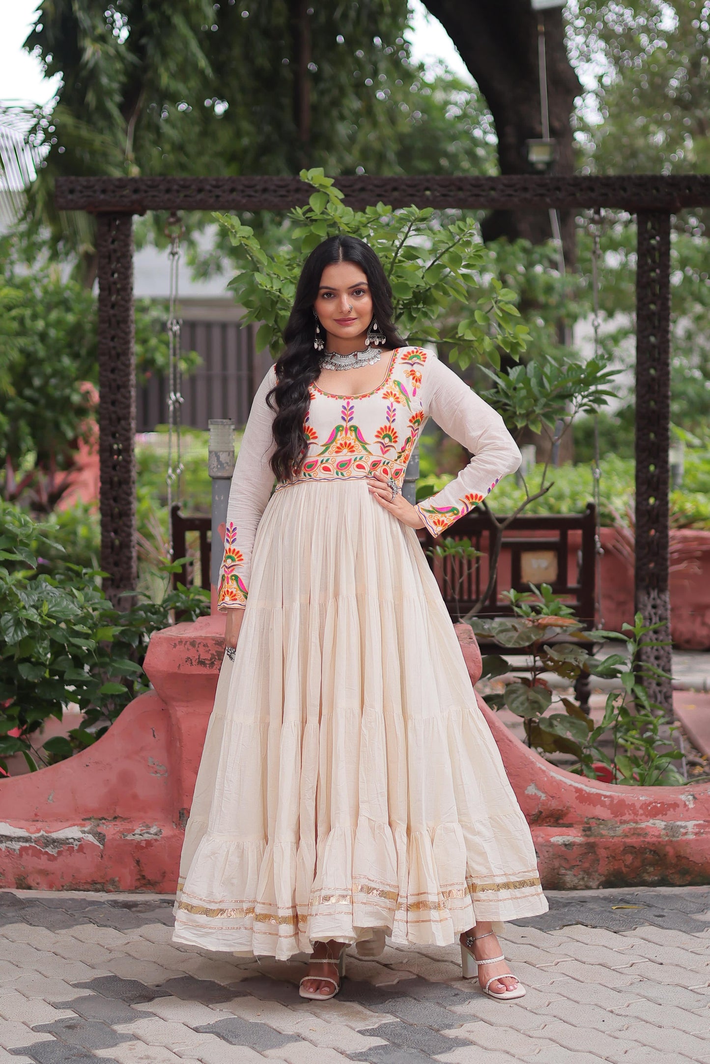 Off white color gown in cotton fabric with 10 + meter flair