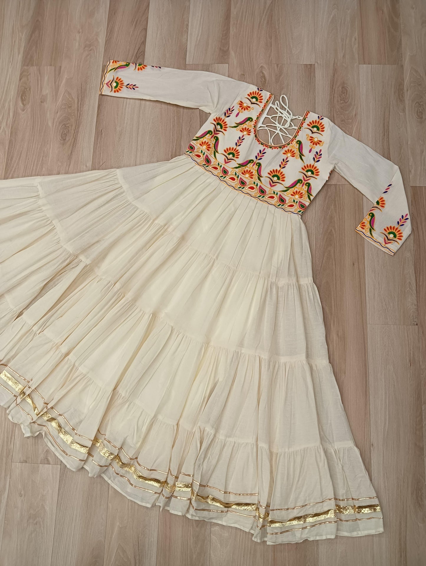 Off white color gown in cotton fabric with 10 + meter flair