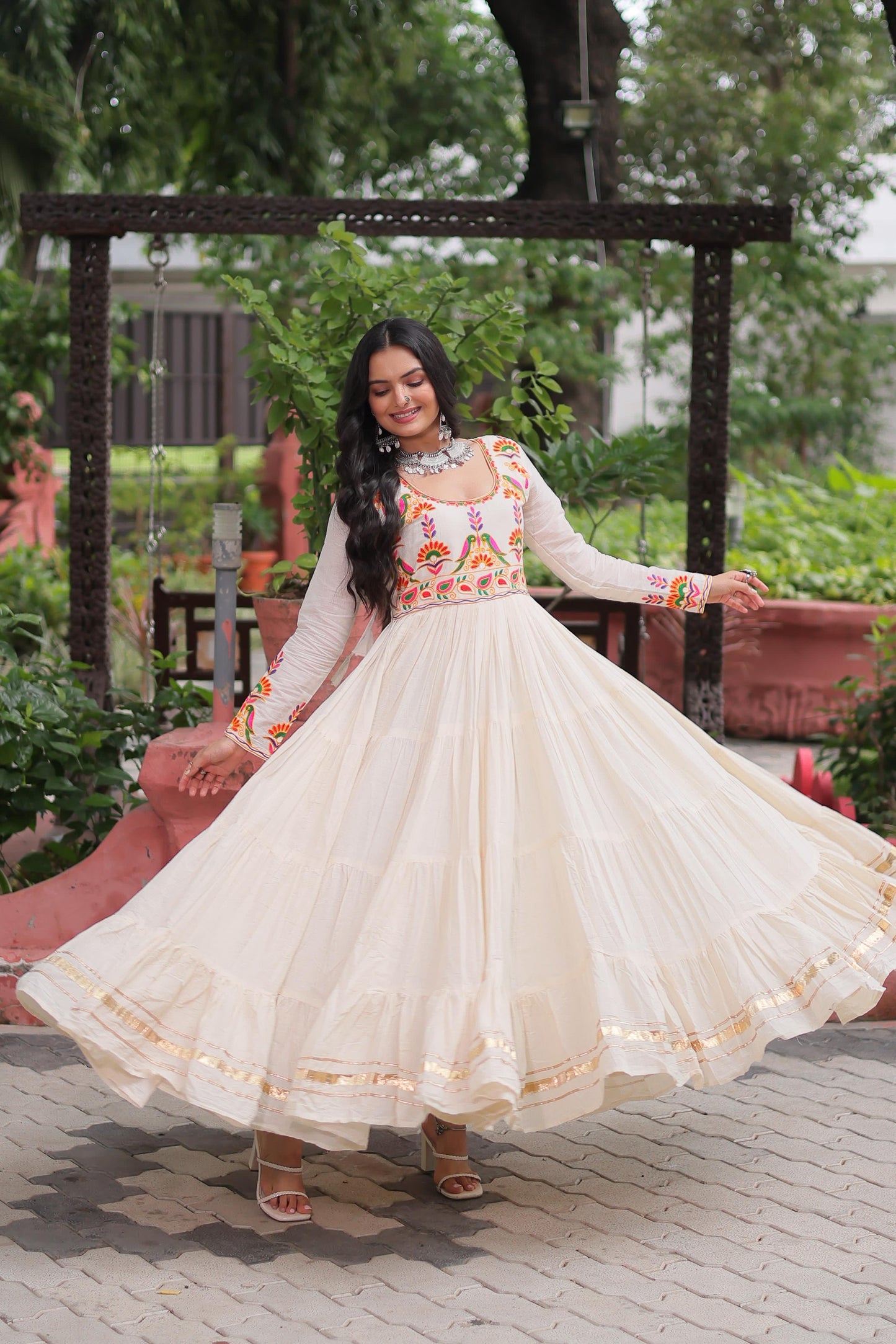 Off white color gown in cotton fabric with 10 + meter flair