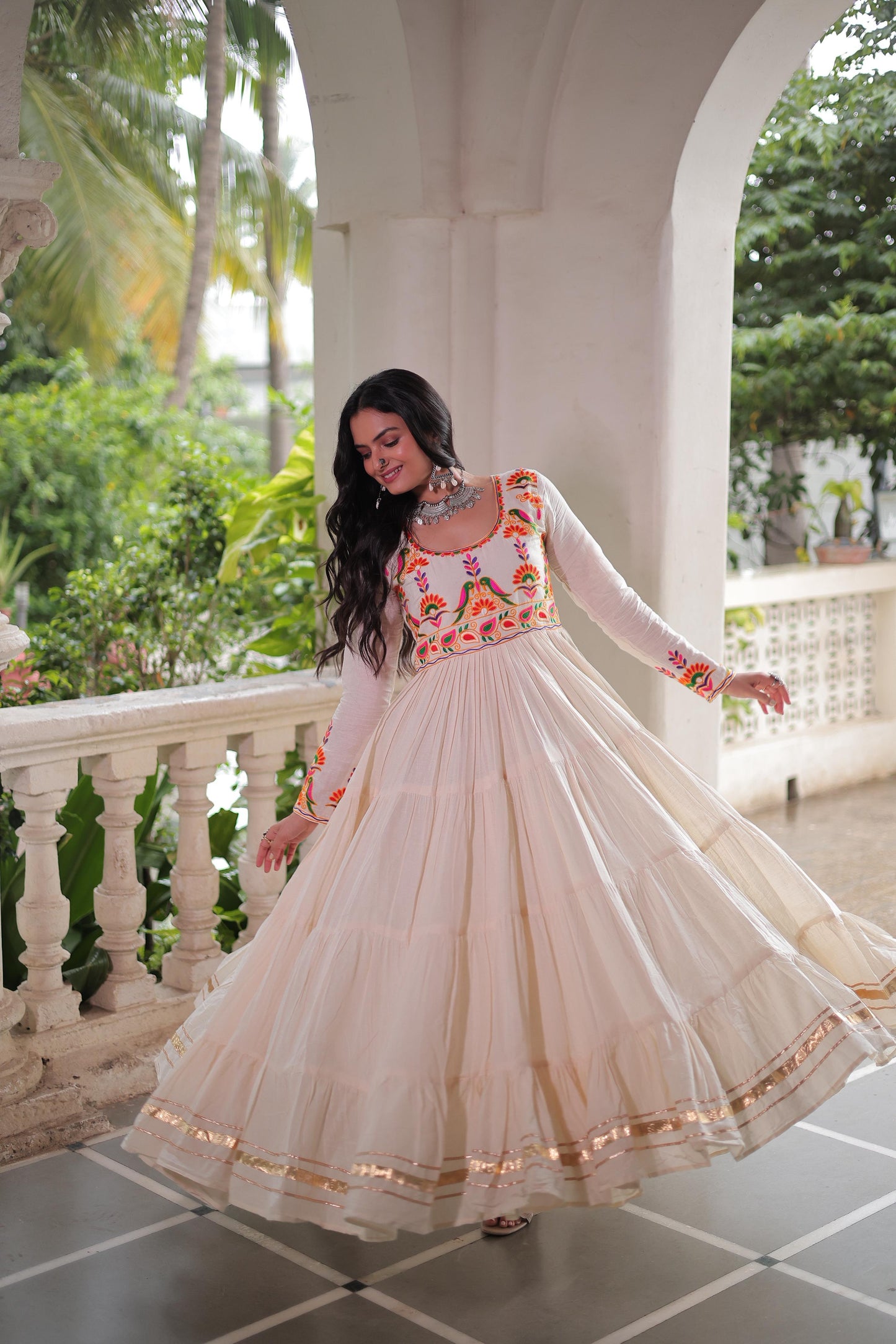 Off white color gown in cotton fabric with 10 + meter flair