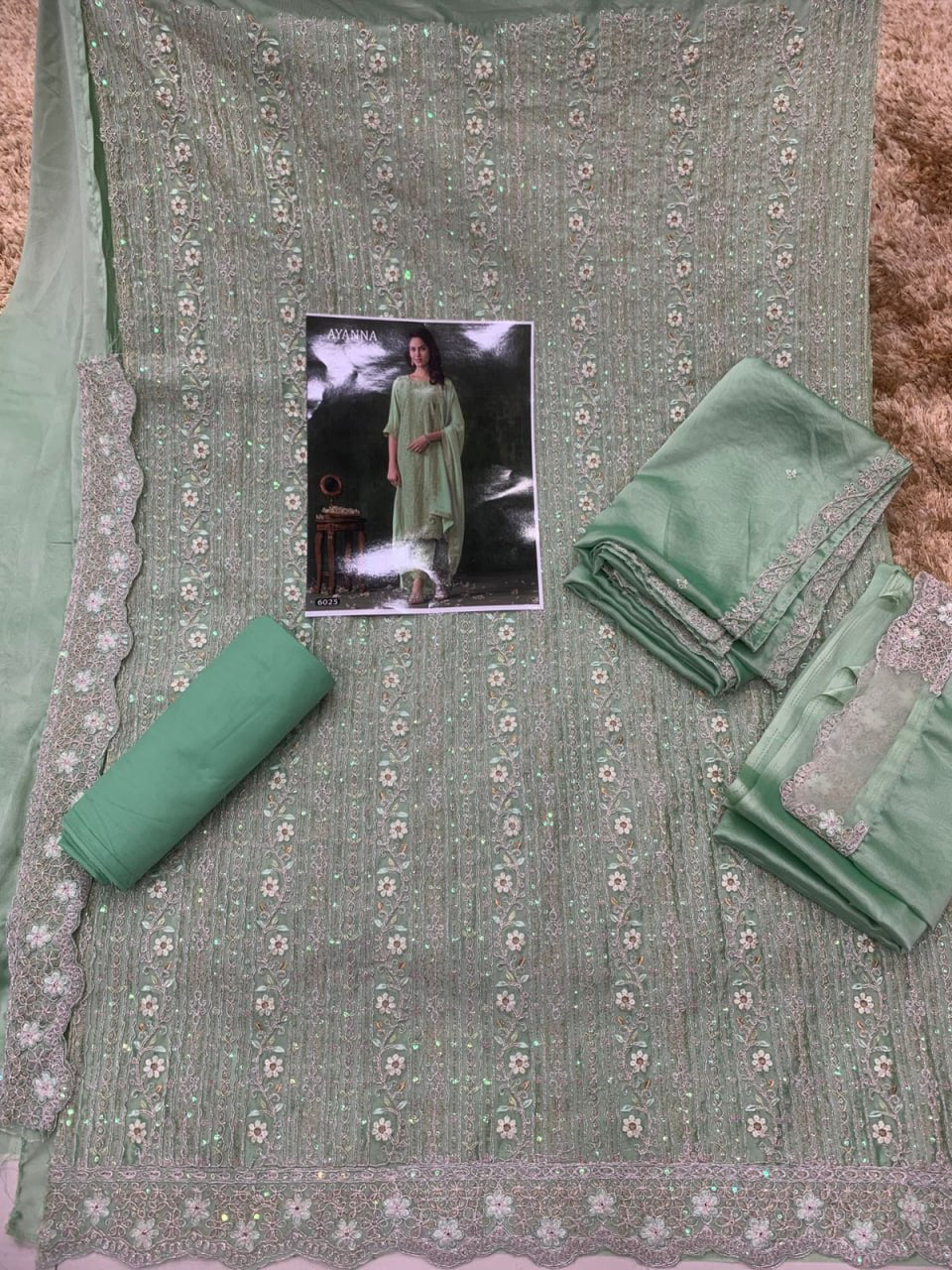 Beautiful Partywear Heavy Unstitched Rangoli Silk Suit in green color