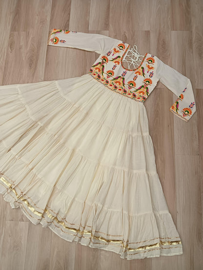 Off white color gown in cotton fabric with 10 + meter flair